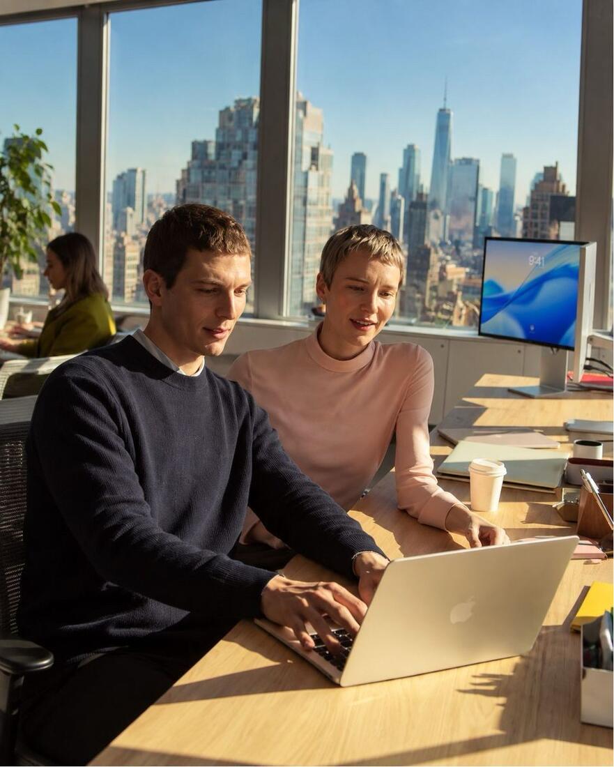 Two hiring managers going through a shortlist