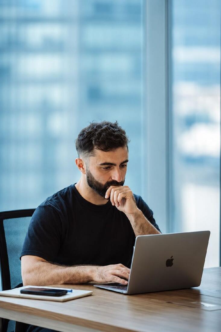Recruiter reviewing candidates on a laptop